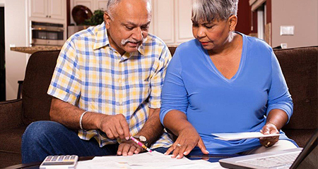 Couple reviewing their bills.